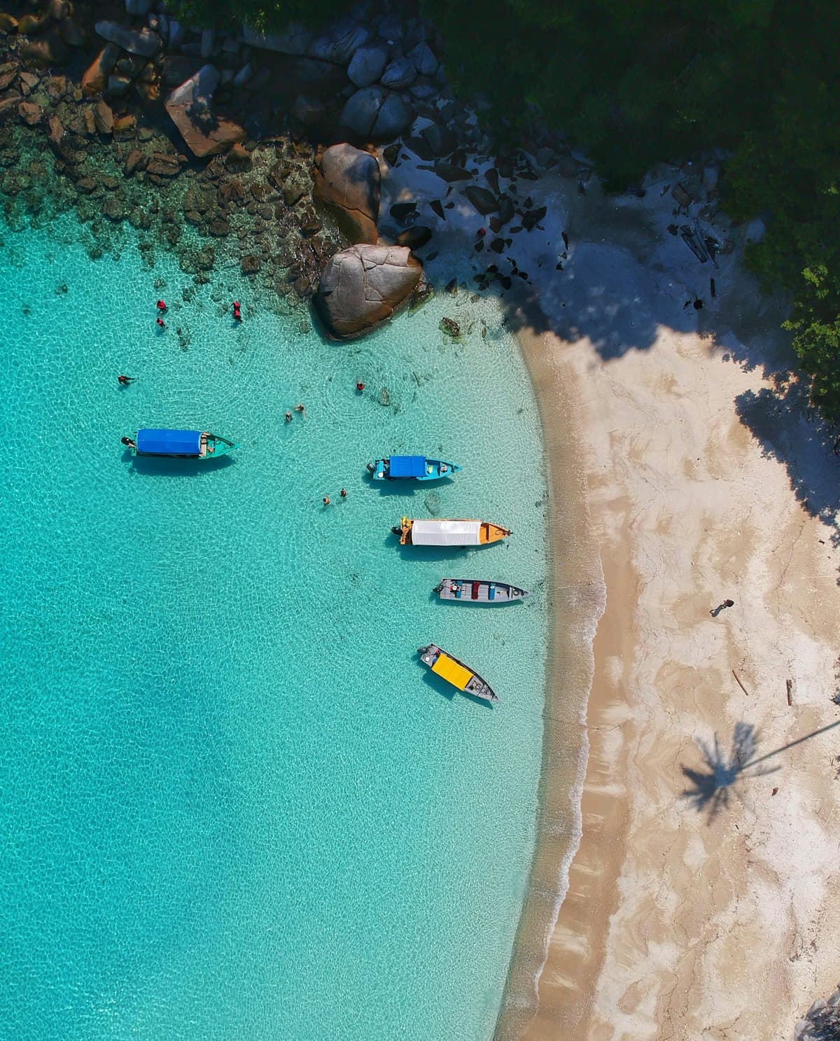 Aerial view of a curved beach in North Goa
